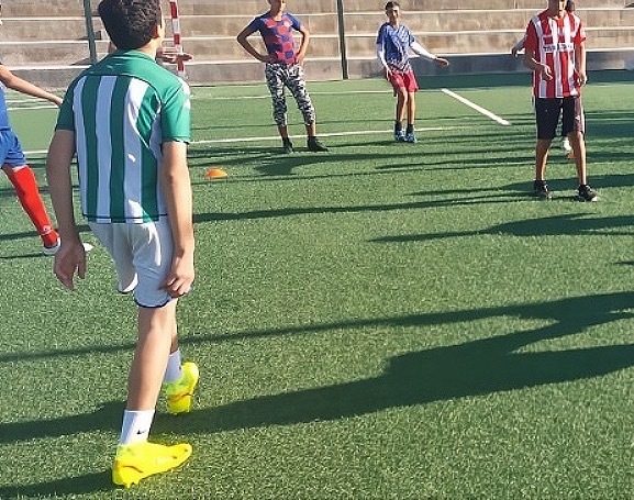 Children training on a football pitch near Tetouan